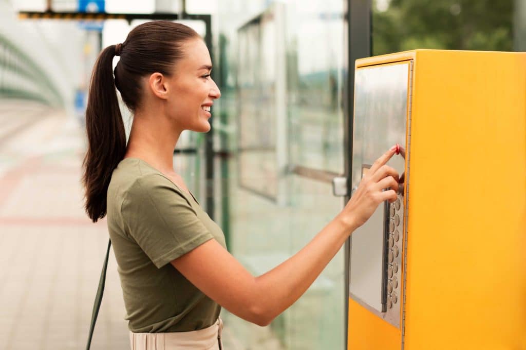 happy passenger woman buying tram tickets via vend 2023 11 27 04 55 03 utc 1 scaled 1